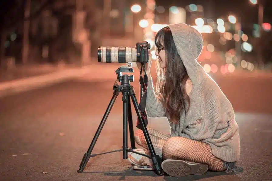 a woman clicking pictures with camera